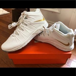 NWT Nike Huarache 4 with gold swoosh.